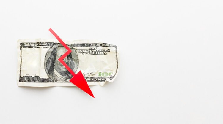 U.S. dollar bill with a red downward arrow symbolizing a sharp decline in financial penalties, revenue, or economic value.